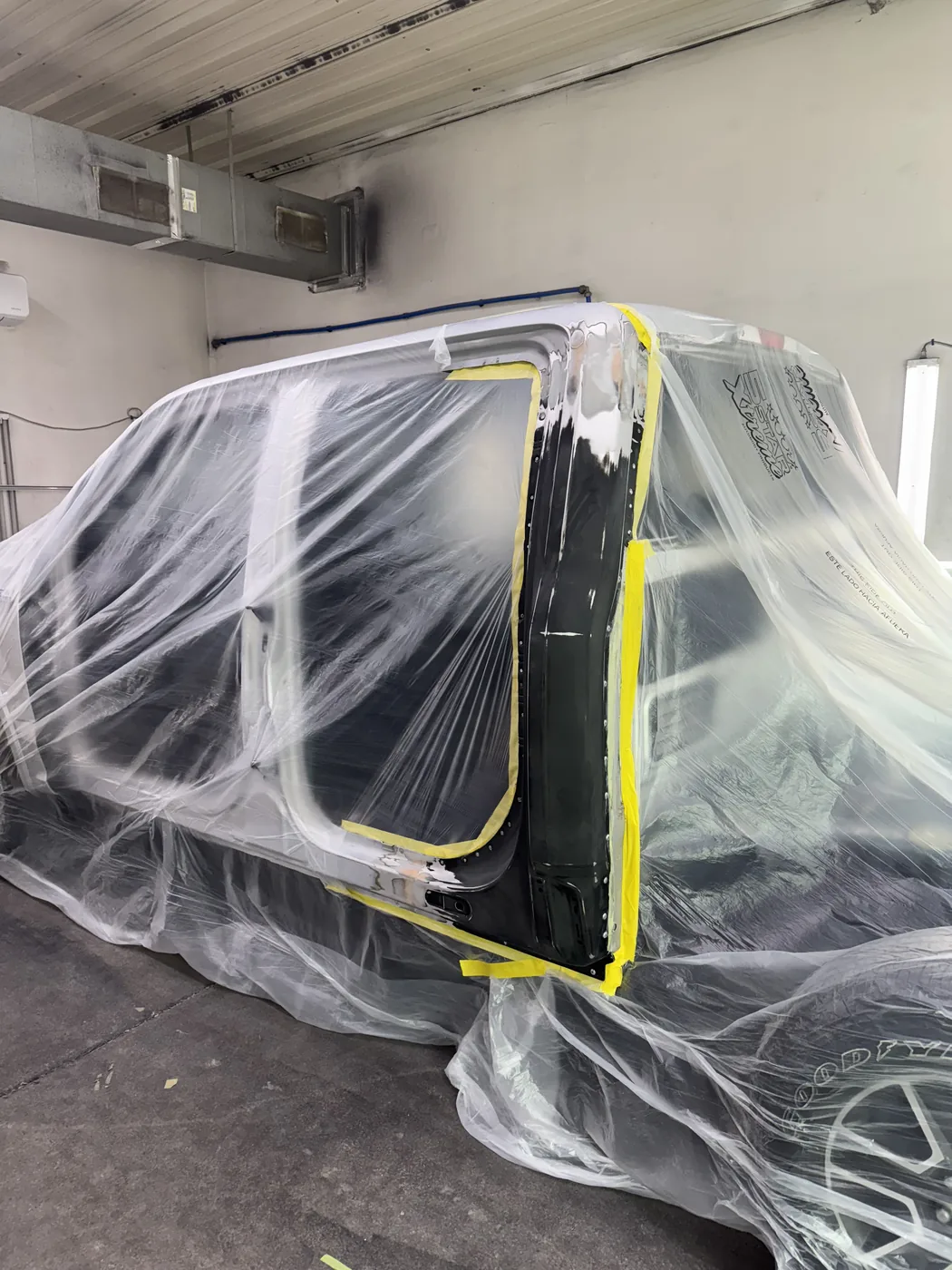 Truck cab masked for refinishing work