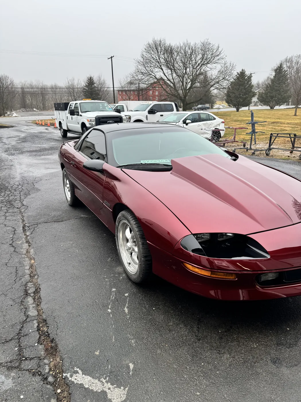 Red Camaro photographed from the front after bodywork