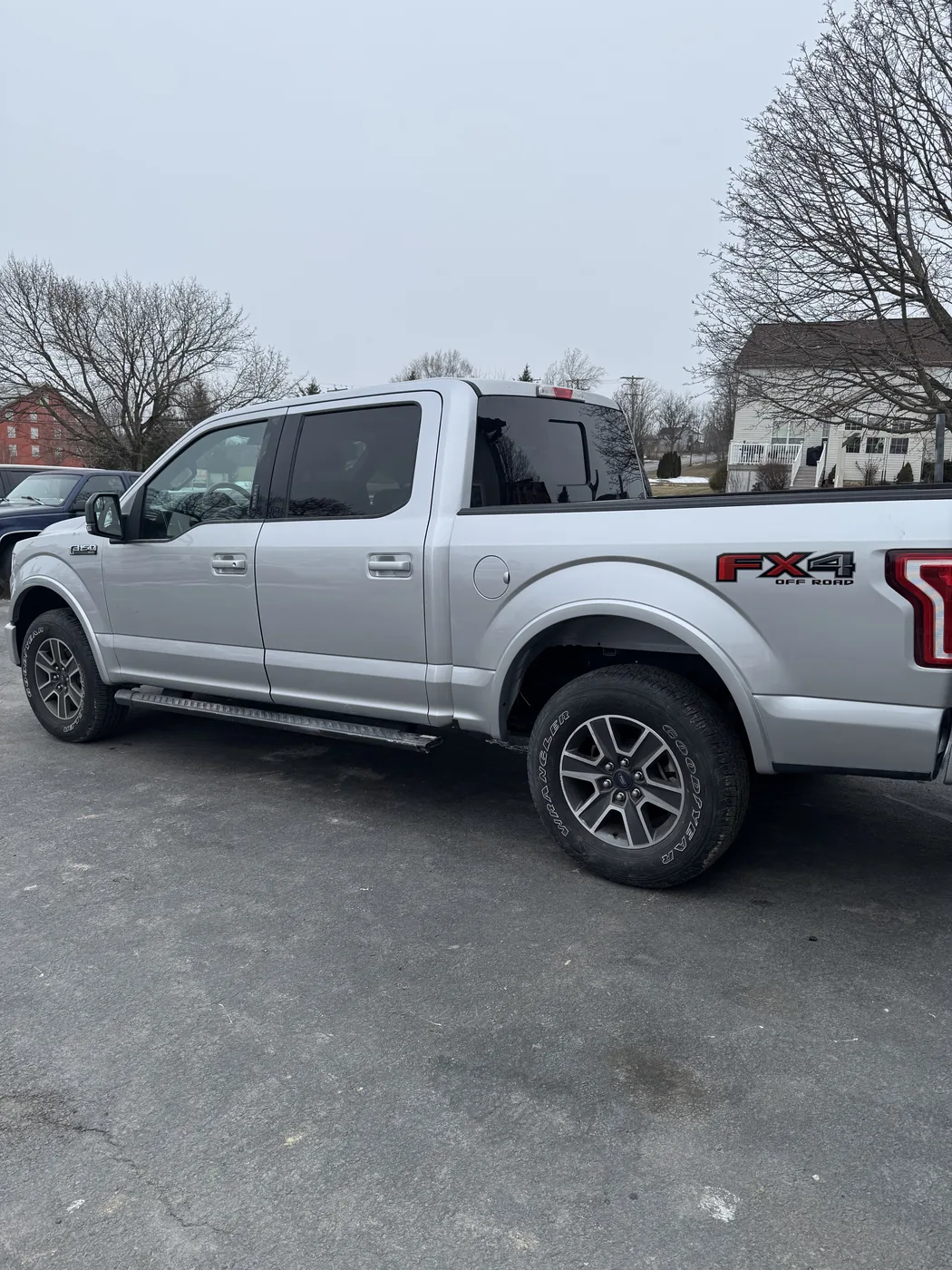 Completed silver pickup truck after repair